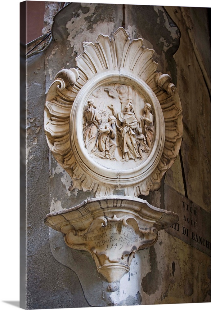 St. Vincent Ferrerio stone carving in the old town, Genoa, Liguria, Italy