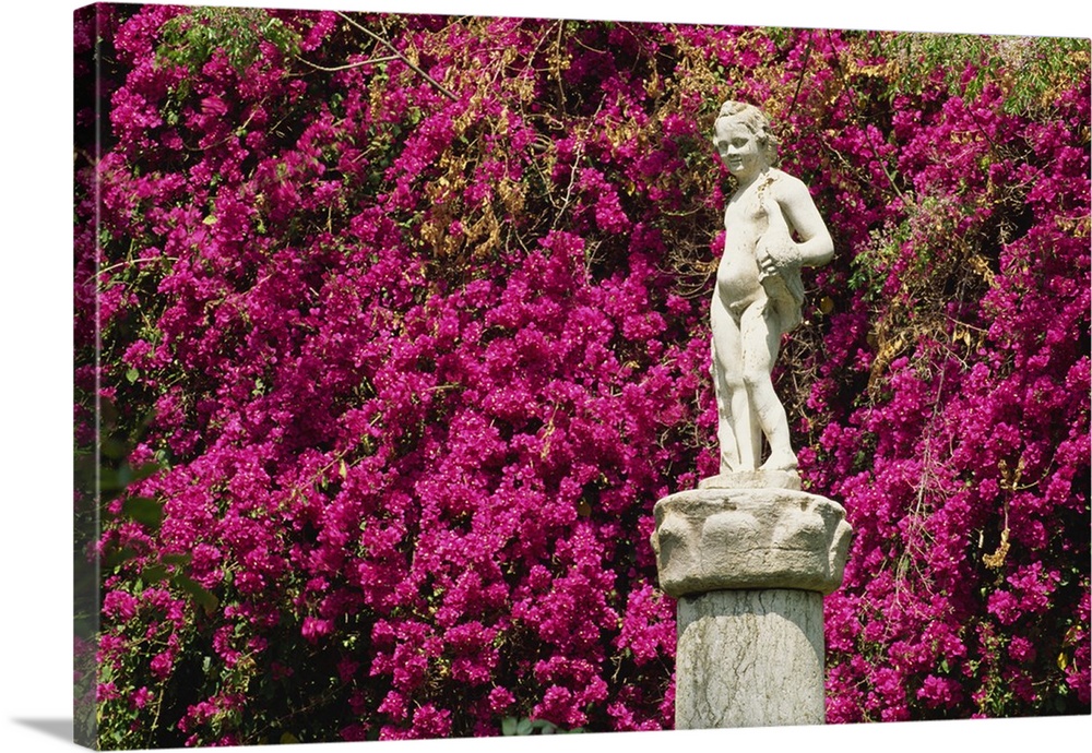 Statue and bougainvillea in the gardens, Casa de Pilatos, Seville, Andalucia, Spain