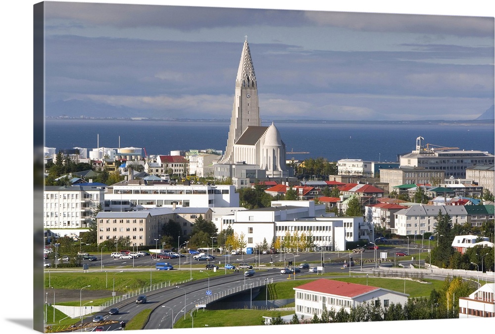 The 75m tall steeple and vast modernist church of Hallgrimskirkja, rising above the city, built between 1940 and 1974, Rey...