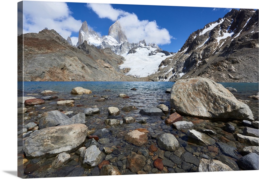 Stones seen through the water of Lago de los Tres featuring Monte Fitz Roy in the background. Monte Fitz Roy, Patagonia, A...