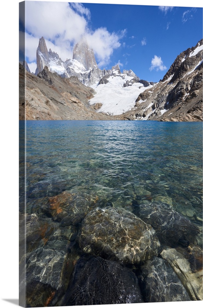 Stones seen through the water of Lago de los Tres featuring Monte Fitz Roy in the background, Patagonia, Argentina, South ...