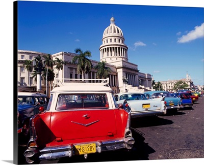 Street scene of taxis parked near the Capitolio Building in Central Havana, Cuba