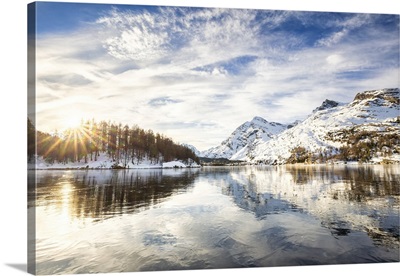 Sun Illuminates The Icy Surfaces Of Lake Sils, Engadine Valley, Swiss Alps, Switzerland