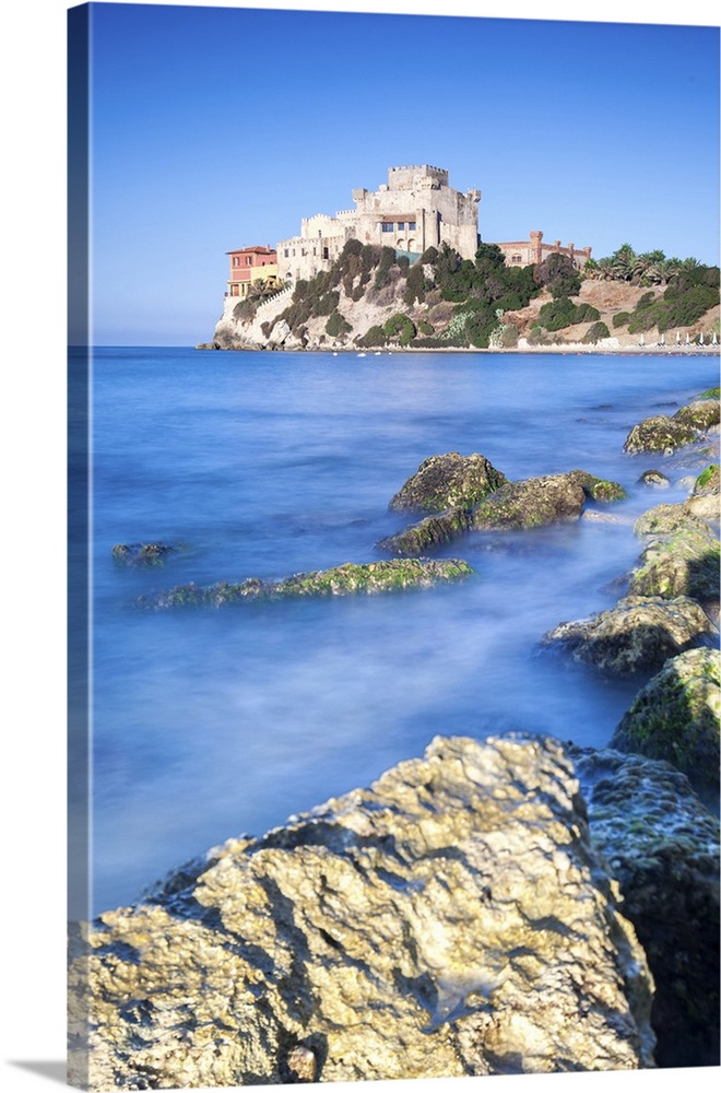 Sunrise on turquoise sea frames the medieval Falconara Castle, Butera, Province of Caltanissetta, Sicily, Italy