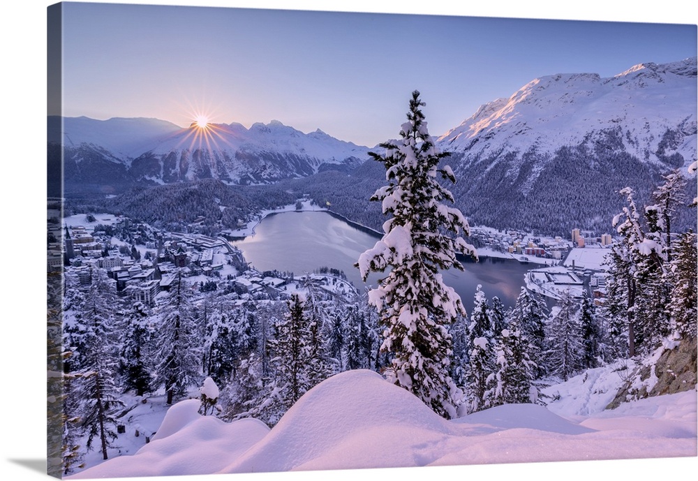 Sunrise over village and Lake of St. Moritz covered with snow, Engadine, Canton of Graubunden, Switzerland, Europe
