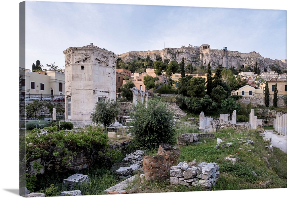 Sunrise view of the Roman Agora, showcasing the Tower of the Winds, an octagonal Pentelic marble clock tower, with the Acr...