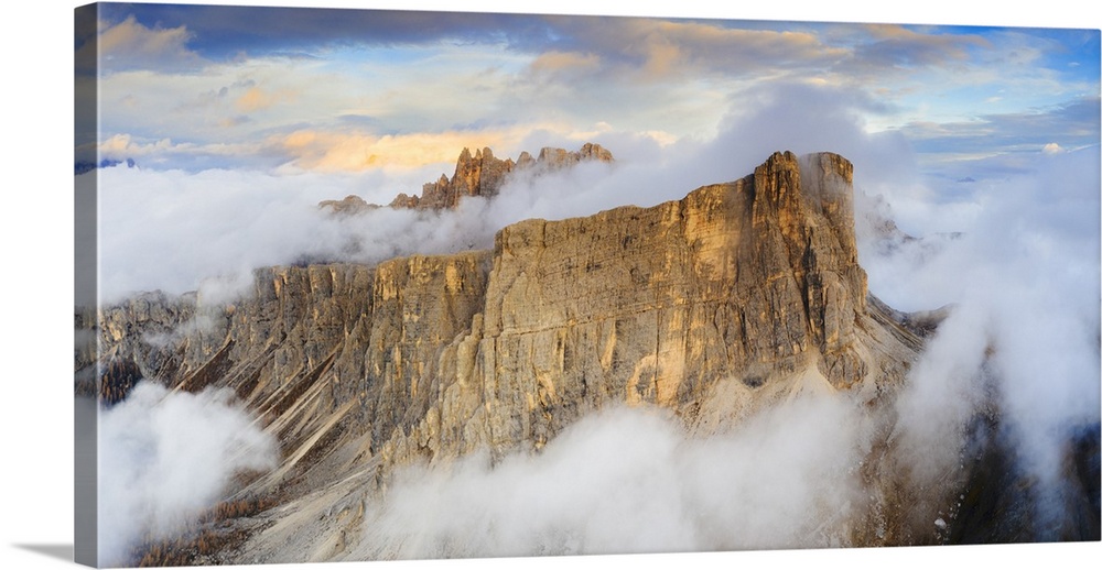 Aerial view by drone of sunset over Lastoi De Formin and Cima Ambrizzola in a sea of clouds in autumn, Giau Pass, Dolomite...