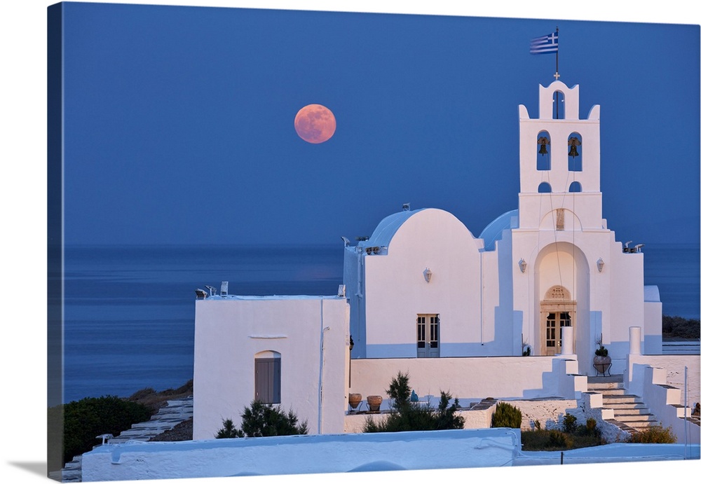 Super moon rising behind Chrisopigi Monastery on Sifnos island at dusk, Cyclades, Greek Islands, Greece, Europe