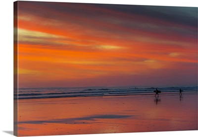 Surfer Silhouetted On Guiones Beach At Sunset, Costa Rica