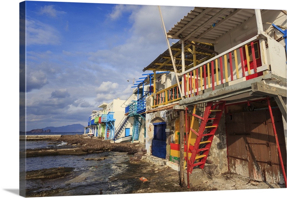 Syrmata, traditional fishermen's encampments with brightly painted woodwork, fishing village of Klima, Milos, Cyclades, Gr...