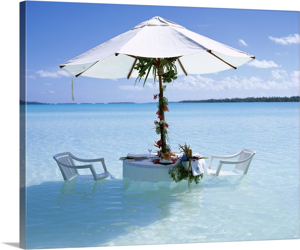 Table, chairs and parasol in the ocean, Bora Bora Tahiti, French Polynesia