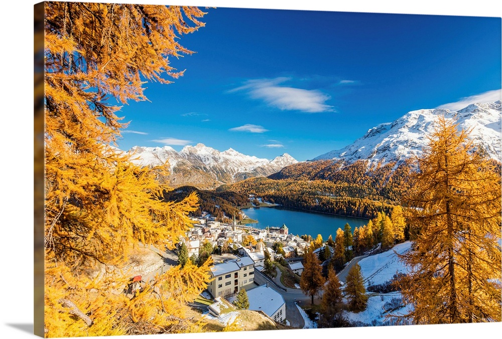 The alpine village of St. Moritz framed by colorful woods and the blue lake, Canton of Graubunden, Engadine, Switzerland