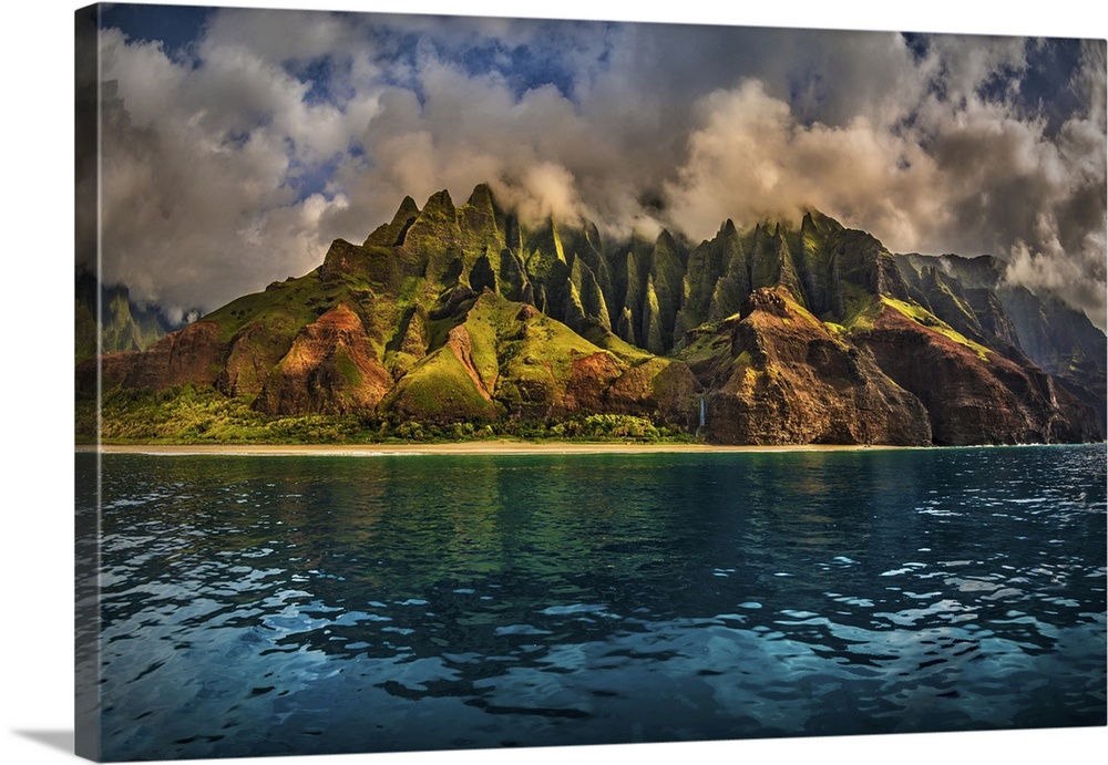 The Cathedral of the NaPali Coastline towers over the calm summer waters at sunset, Hawaii, United States of America, Pacific