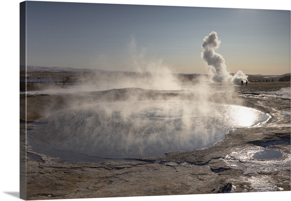 The great geyser Geysir, now dormant , with the more active Strokkur geyser erupting in the distance, Geysir, Haukadalur v...