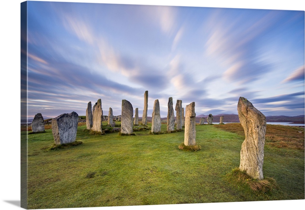 The Lewisian gneiss stone circle at Callanish on an early autumnal morning with clouds forming above, Isle of Lewis, Outer...
