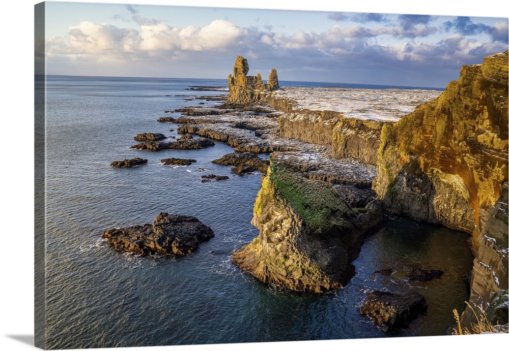 The Londrangar Cliffs covered in a light snow dusting, western Iceland, Polar Regions