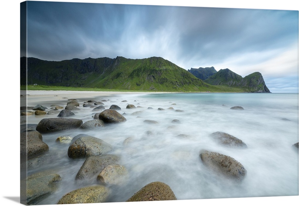 The midnight sun lights up the waves of the blue sea, Unstad, Vestvagoy, Lofoten Islands, Arctic, Norway, Scandinavia