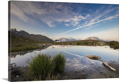 The sky is reflected in the alpine lake, Muottas Muragl, Samedan, Engadine, Switzerland