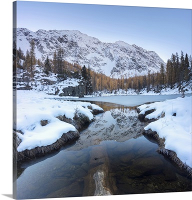 The snowy peaks reflected in Lake Mufule, Malenco Valley, Valtellina, Lombardy, Italy