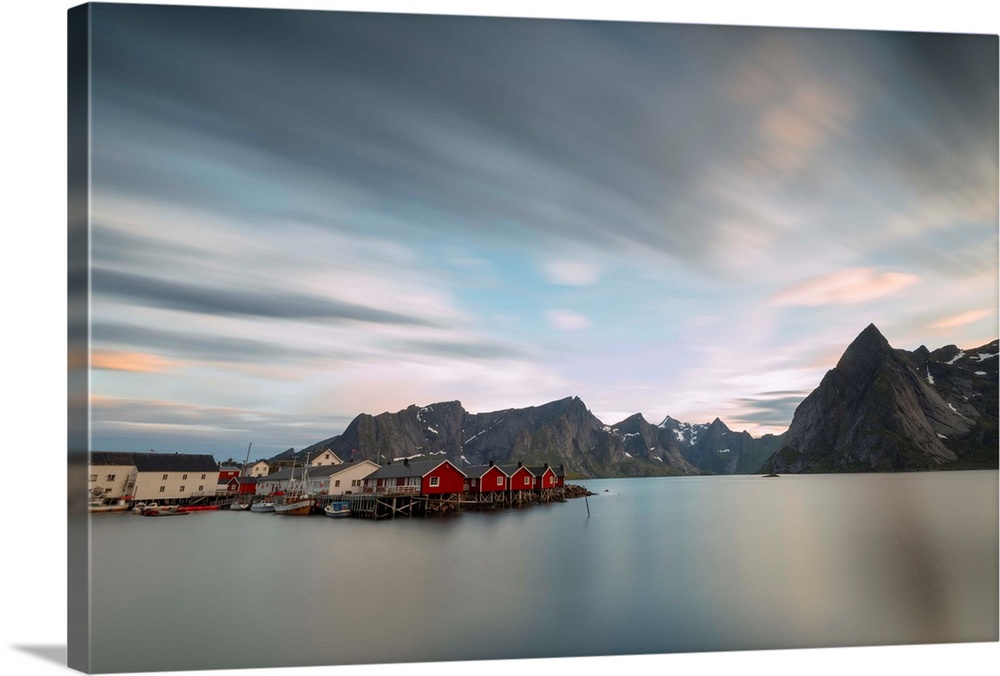 The summer sunset at night on fishing village and cold sea, Hamnoy, Moskenesoya, Nordland county, Lofoten Islands, Norway,...