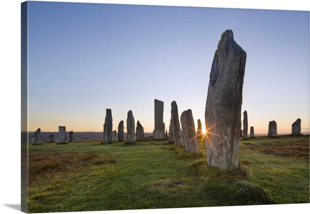 The sun rises at Callanish stone circle, Isle of Lewis, Outer Hebrides, Scotland, United Kingdom, Europe