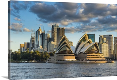 The Sydney Opera House, and skyline of Sydney at sunset, New South Wales, Australia