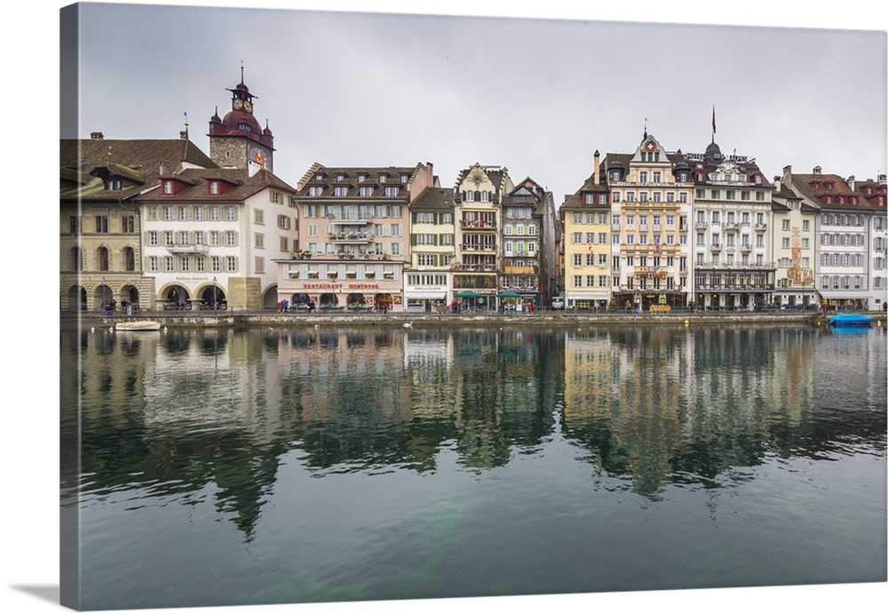 The typical buildings of the old medieval town are reflected in River Reuss, Lucerne, Switzerland, Europe