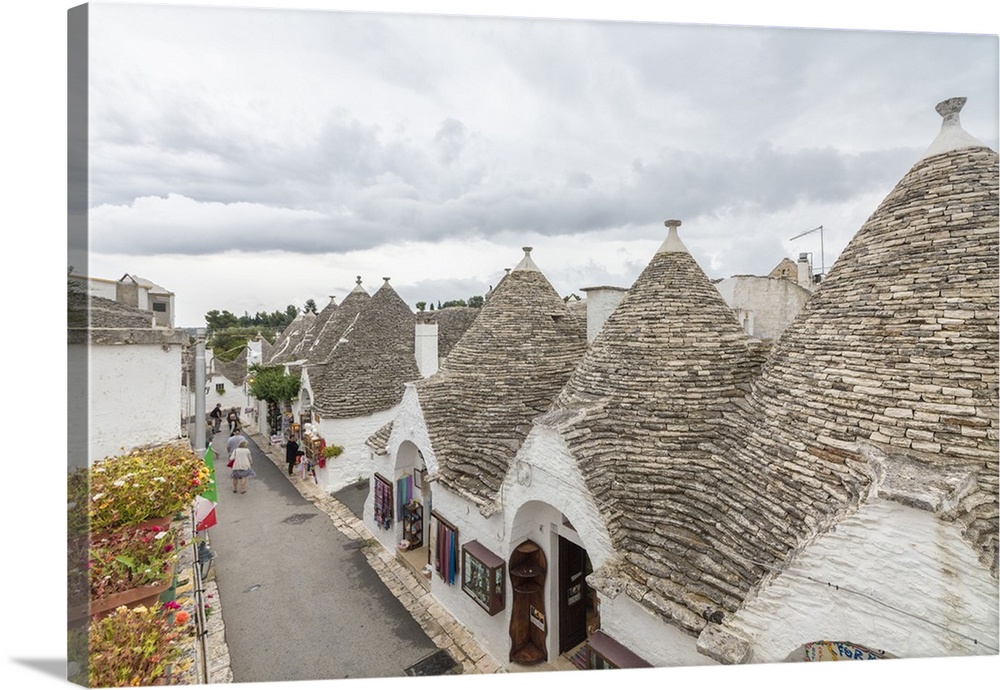 The typical huts called Trulli built with dry stone with a conical roof, Alberobello, Province of Bari, Apulia, Italy