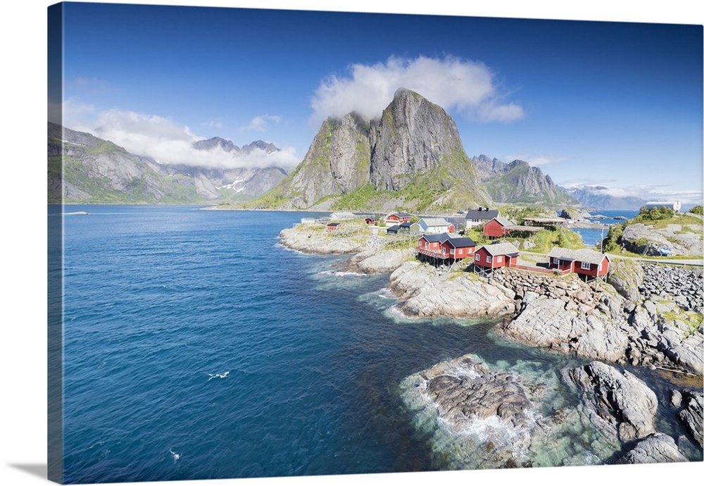 Top view of the fishing village framed by blue sea and high peaks Hamnoy, Moskenesoya, Nordland county, Lofoten Islands, N...