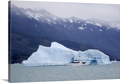 Tourist boat and iceberg near Upsala Glacier on Lago Argentino, Patagonia, Argentina