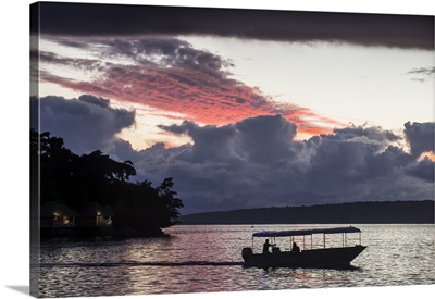Tourist boat driving back home at sunset in Port Vila, Efate, Vanuatu