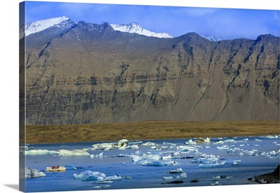Tourist boat in icebergs in the Jokulsarlon glacial lake in Vatnajokull National Park