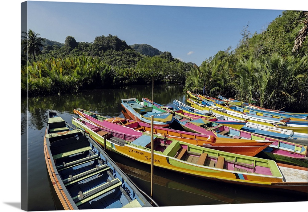 Tourist tour boats on Pute River in karst limestone region, Rammang-Rammang, Maros, South Sulawesi, Indonesia, Southeast A...