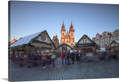 Tourists at the Christmas markets facing the Cathedral of St. Vitus, Old Town Square