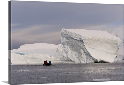 Tourists exploring Skontorp Cove in inflatable boat, Paradise Bay, Antarctica