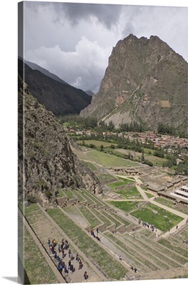 Tourists visit the ruins of the Inca archaeological site of Ollantaytambo near Cusco
