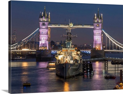Tower Bridge and HMS Belfast on the River Thames at dusk, London, England