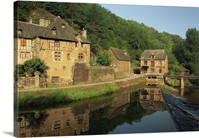 Tranquil scene of reflections in water of a millhouse, Midi-Pyrenees, France