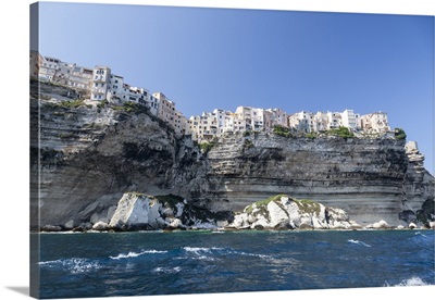 Turquoise sea frames the village perched on the white cliffs, Bonifacio, Corsica, France