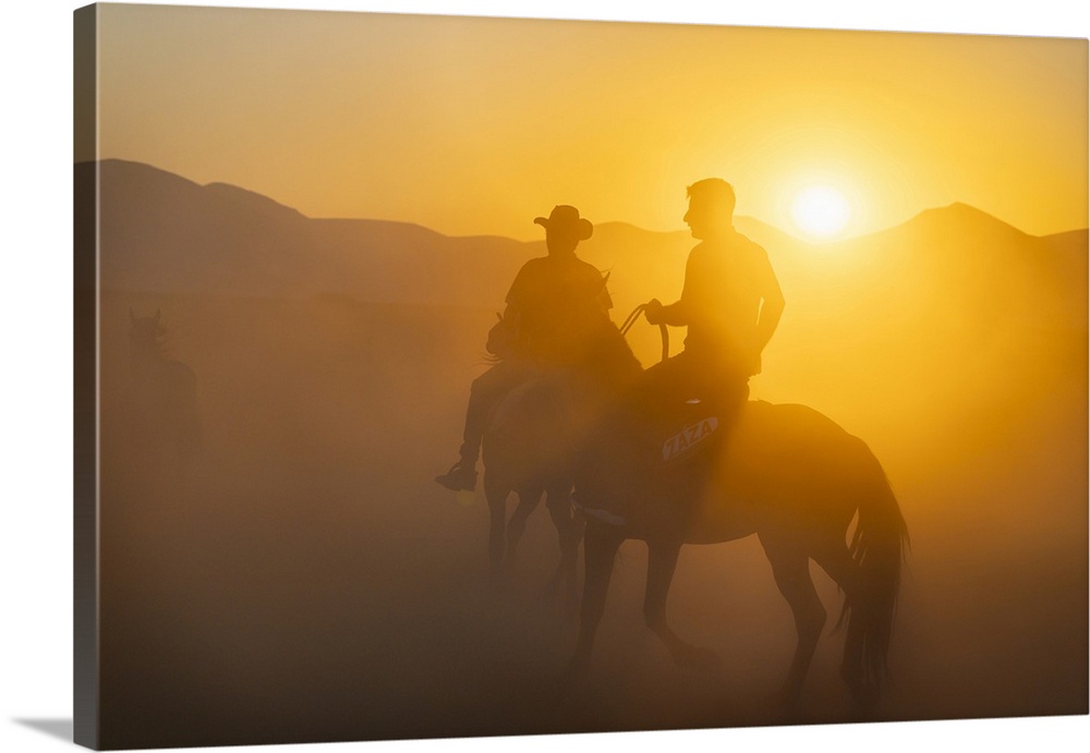 Two cowboys on horses at sunset, Hacilar, Kayseri, Cappadocia, Anatolia, Turkey, Asia Minor, Asia