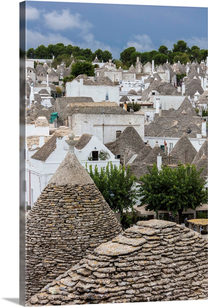 View of the typical Trulli built with dry stone with a conical roof, Alberobello, Province of Bari, Apulia, Italy