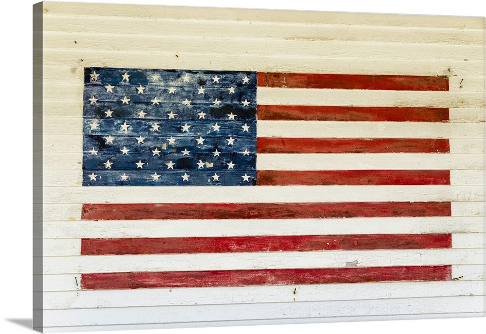 US Flag painted on the side of a wooden building in the historic area of Chatham, Massachusetts, New England, United State...