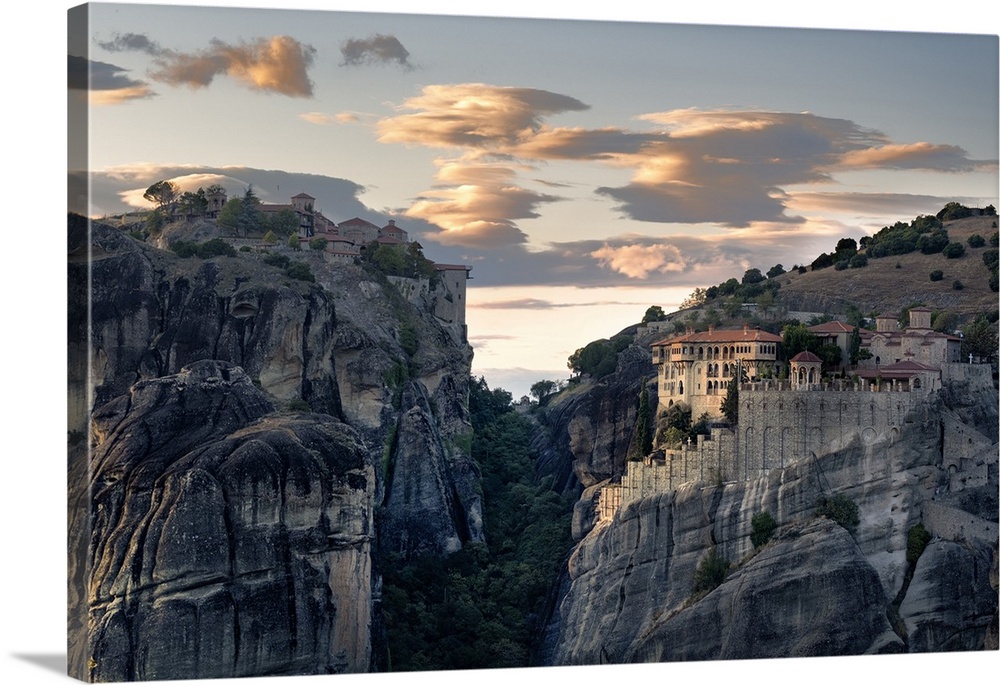 Sunset light on clouds and Varlaam and Megalo Meteoro Monasteries, Meteora, UNESCO World Heritage Site, Thessaly, Greece, ...