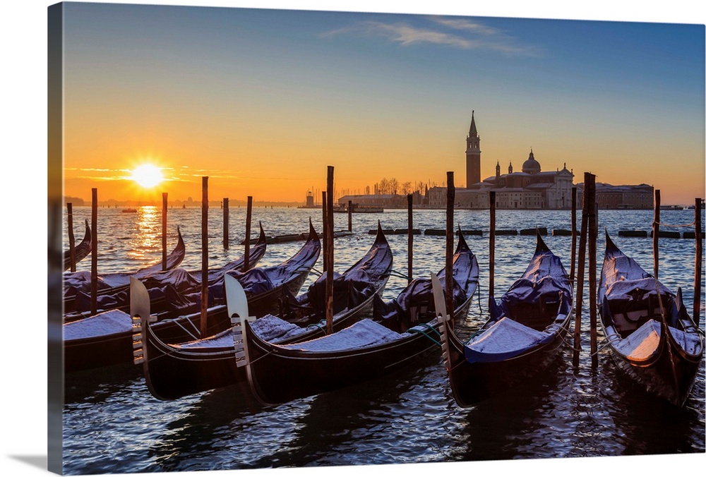 Venetian winter sunrise after snow with gondolas, San Giorgio Maggiore and Lido, Venice, Veneto, Italy