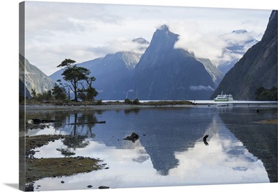 View down Milford Sound, mountains reflected in water, New Zealand