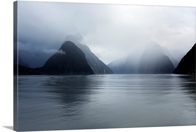 View down rainswept Milford Sound, mountains obscured by cloud, New Zealand