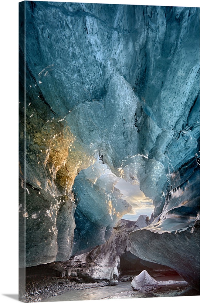 View inside an ice cave under the south Vatnajokull Glacier, captured at sunrise during winter when the ice caves are acce...