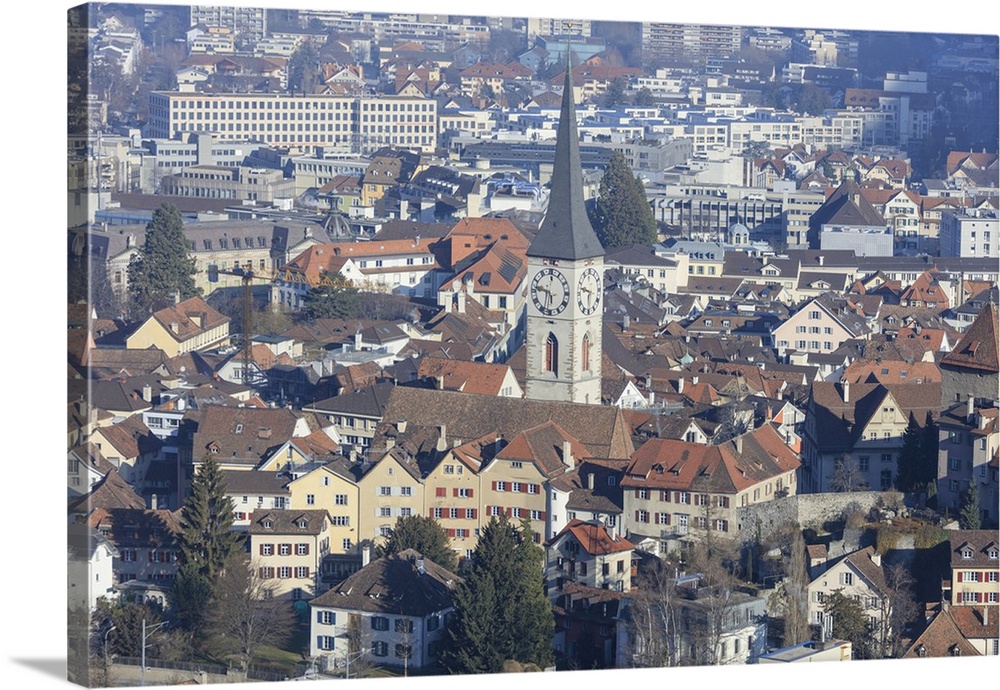 View of bell tower of Church of St. Martin and the city of Chur, district of Plessur, Canton of Graubunden, Swiss Alps, Sw...