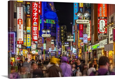 View Of Busy Street And Neon Lights At Night In Shibuya District, Tokyo, Japan