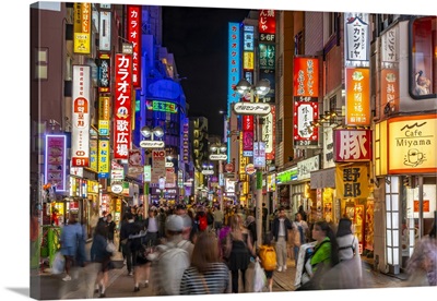 View Of Busy Street And Neon Lights At Night In Shibuya District, Tokyo, Japan